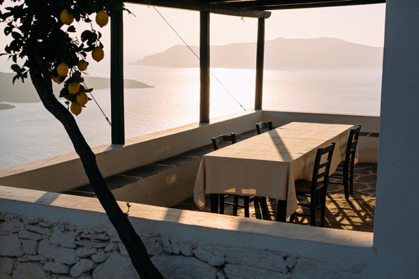 Stone terrace above a hazy Mediterranean bay